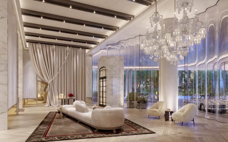 Lobby lounge at Baccarat Residences Brickell featuring crystal chandeliers, velvet seating, and floor-to-ceiling glass walls.