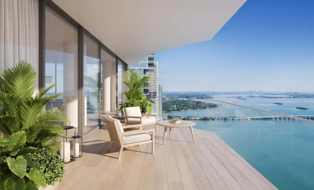 Outdoor balcony seating area with panoramic views toward the Venetian Islands.