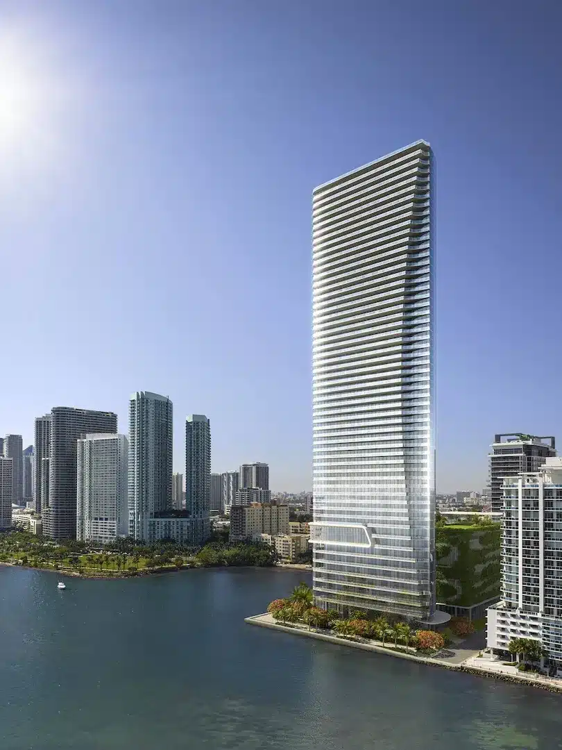 Glass waterfront tower rising along Biscayne Bay in the Edgewater skyline.