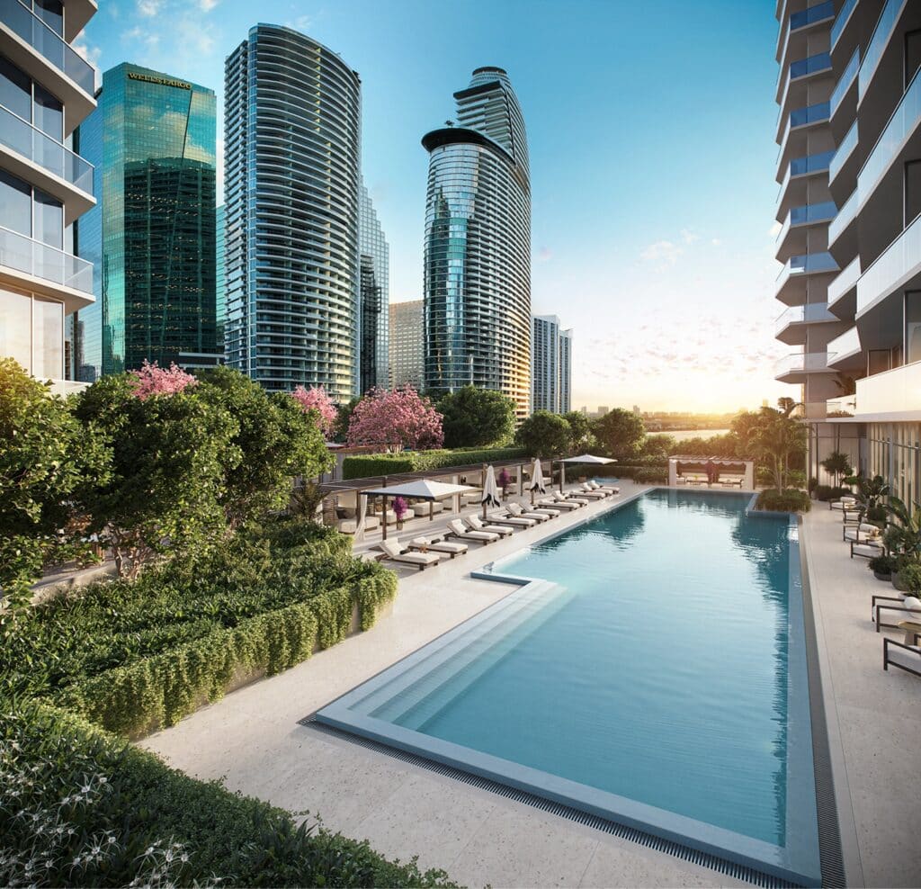 Modern cityscape with sleek skyscrapers, a serene rooftop pool, lounge chairs, lush greenery, and flowering trees under a clear, bright sky.