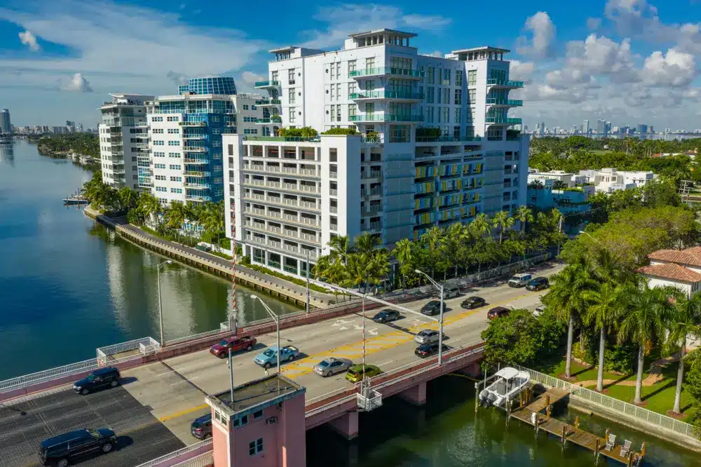 Waterfront condominiums on Allison Island in Miami Beach overlooking the Indian Creek Waterway, with palm trees, bridge access, and bay views. Select 79 more words to run Humanizer.