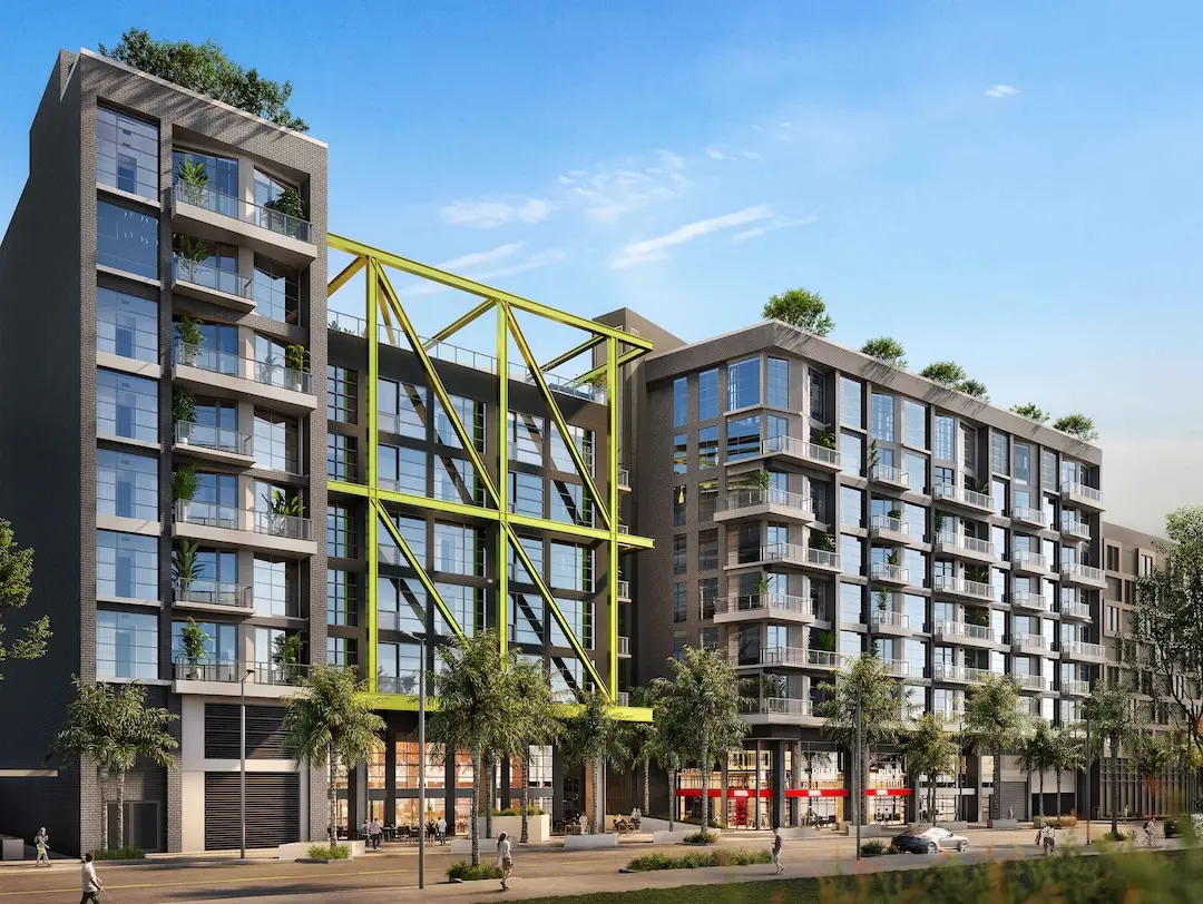 Diesel Wynwood condo building in Miami featuring modern architecture, street-level retail, and residential balconies.