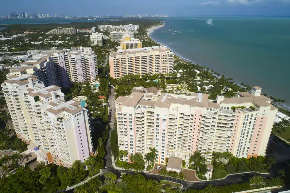 Aerial view of oceanfront condominium buildings along the shoreline of Key Biscayne