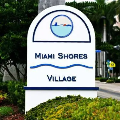 Miami Shores Village entrance sign along a residential street.
