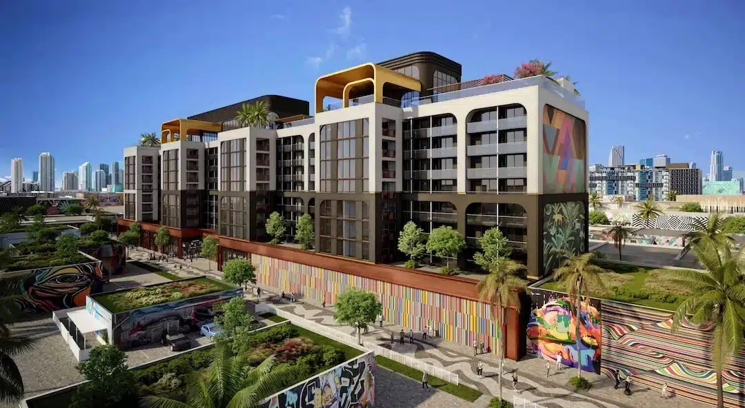 Modern condo development in Wynwood Miami featuring contemporary architecture, street art murals, and skyline views.